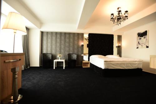 Posteľ alebo postele v izbe v ubytovaní La Rocca Boutique Hotel