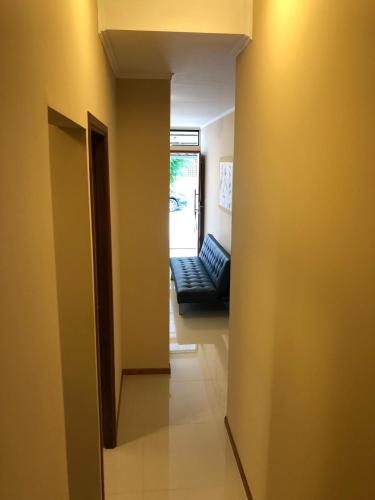 a hallway with a couch in a room at Apartamentos Piriapolis in Piriápolis