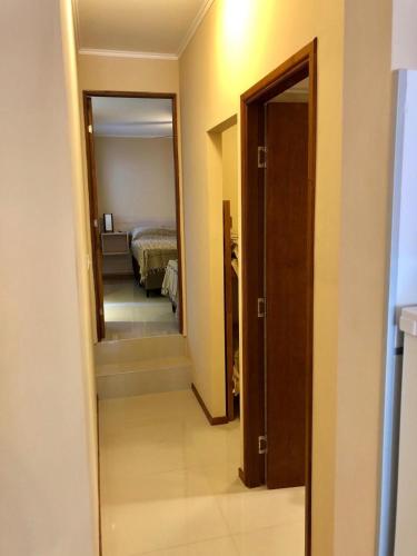 a hallway with a door leading to a bedroom at Apartamentos Piriapolis in Piriápolis