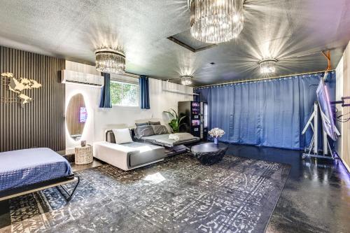 a living room with a couch and a bed at Boise Home with Hot Tub, Yard about 5 Mi to Dtwn! in Boise