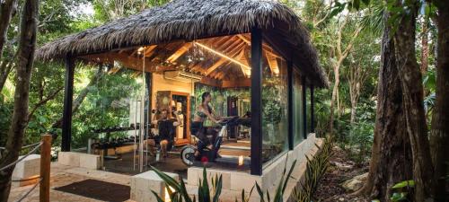 a small house in the middle of a forest at Viceroy Riviera Maya, a Luxury Villa Resort - Adults Only in Playa del Carmen