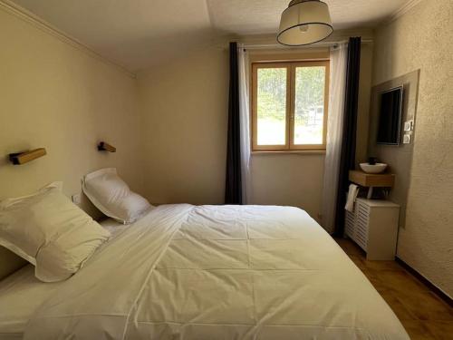 Katil atau katil-katil dalam bilik di Gîte 8 personnes avec piscine