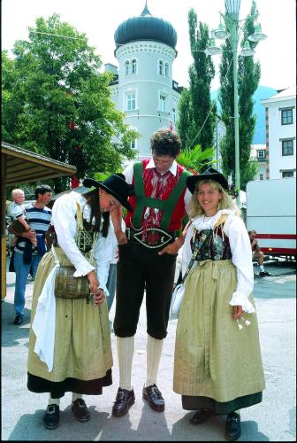 two women and a man dressed in historical costumes at Gästehaus Steinerhof in Nikolsdorf