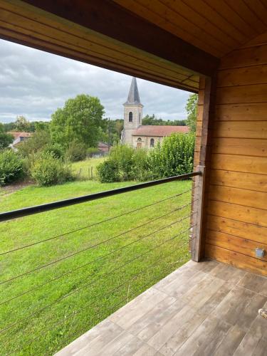 a view from the inside of a porch with a view of a church at Chalet in Parois