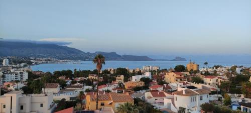 a view of a city and the ocean at Albir cosy apartment in Albir