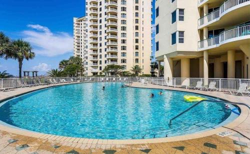 a large swimming pool in front of some buildings at Beach Colony East 14D in Pensacola