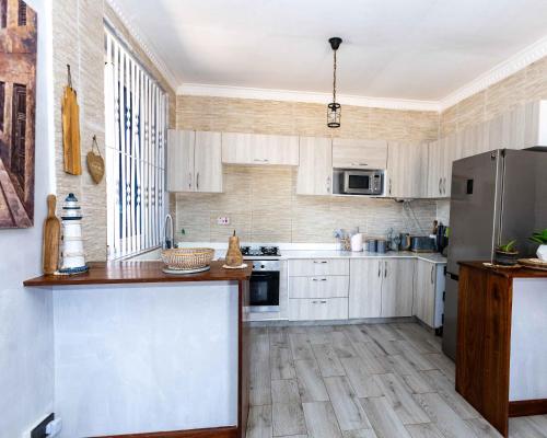 Η κουζίνα ή μικρή κουζίνα στο Kichangani Beach House
