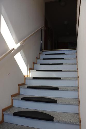 a set of stairs in a building with a window at E4 Recidence Tornio in Tornio
