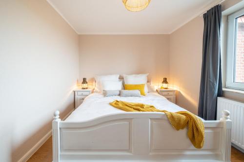 Ένα ή περισσότερα κρεβάτια σε δωμάτιο στο Appartement "Ankerplatz" Cappel Whg 12
