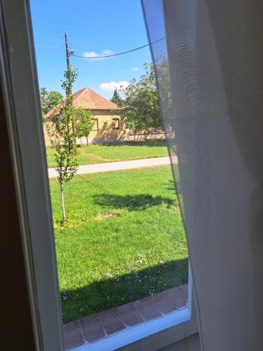 a view of a yard from a window at Eagles Court - Orlovski Vrt in Staji°evo