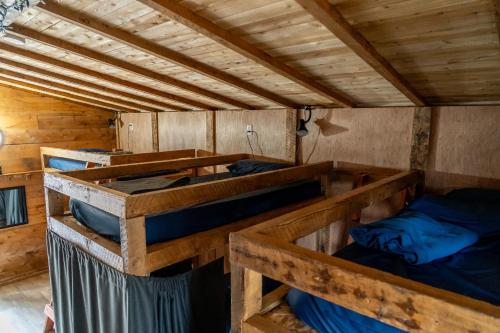 Postel nebo postele na pokoji v ubytování Auberge/Chalet Griffon Aventure