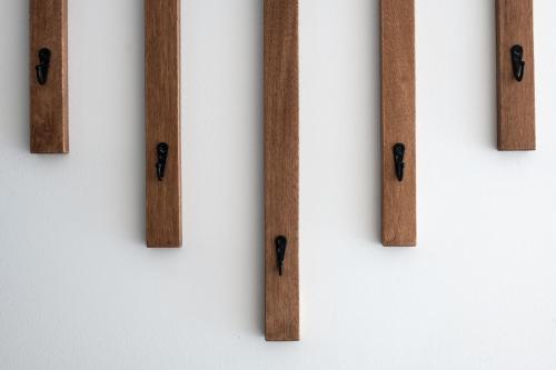 a group of wooden bars on a wall at Le Relais des Hautes Gorges in Saint Aime Des Lacs