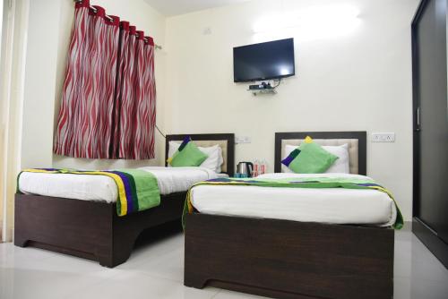 Cama o camas de una habitación en Elite 4 Stays Koramangala