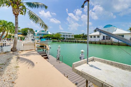 a water park with a slide and a water slide at Waterfront Key Colony Beach Home with Golf Cart! in Key Colony Beach