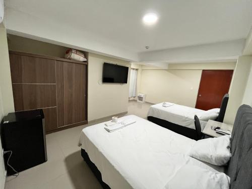 Postel nebo postele na pokoji v ubytování Hotel Manantay Resort