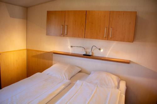 Ένα ή περισσότερα κρεβάτια σε δωμάτιο στο Ferienhaus Mellumplate 08