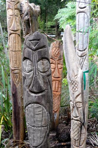 a group of three statues standing next to each other at Magnolia Petal in Ganges