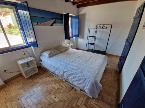 Postel nebo postele na pokoji v ubytování Casa dos Martelitos