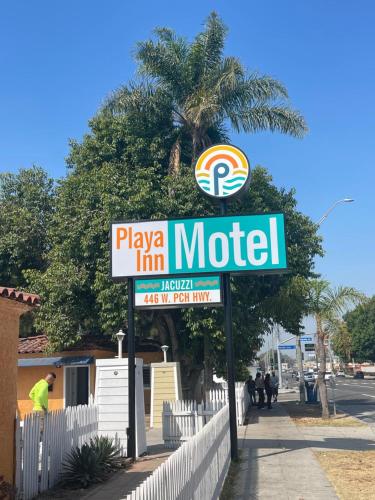 a sign for a motel on the side of a street at Playa Inn Motel - Long Beach, LA in Long Beach