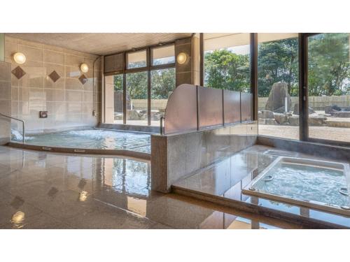 a large room with a pool of water with windows at COCOLAND - Vacation STAY 74003v in Ube