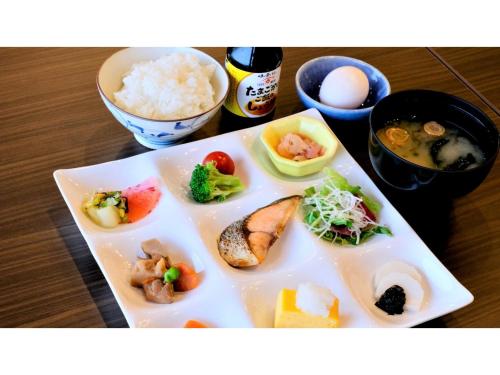 a plate of food with vegetables and rice on a table at COCOLAND - Vacation STAY 73928v in Ube