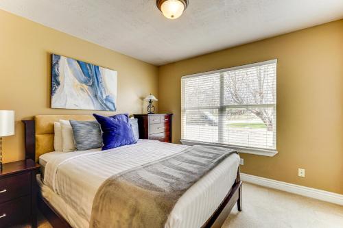 a bedroom with a large bed and a window at Sprawling Utah Mansion with Private Hot Tub and Sauna in Draper