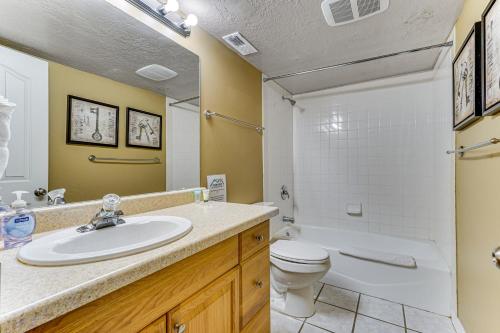 a bathroom with a sink and a toilet at Sprawling Utah Mansion with Private Hot Tub and Sauna in Draper