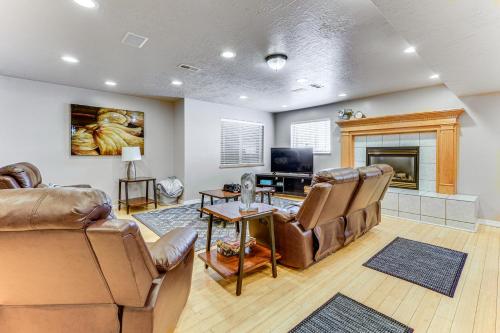 a living room with leather furniture and a fireplace at Sprawling Utah Mansion with Private Hot Tub and Sauna in Draper