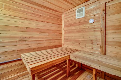 a wooden sauna with a bench in a cabin at Sprawling Utah Mansion with Private Hot Tub and Sauna in Draper