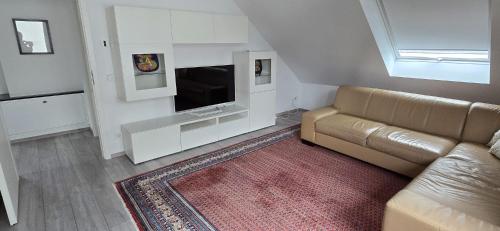 Μια τηλεόραση ή/και κέντρο ψυχαγωγίας στο Wohnung Düsseldorf Ratingen nähe Messe Flughafen Uni Essen