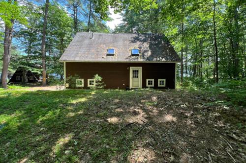a small house in the middle of a forest at Moose & Red Fox Retreat in Denmark