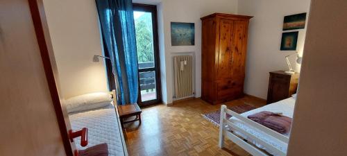 Postel nebo postele na pokoji v ubytování Appartamento ALICE