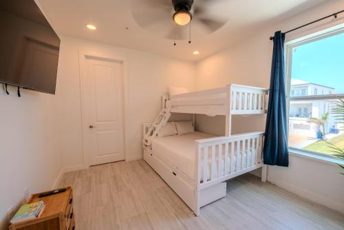 Ένα ή περισσότερα κρεβάτια σε δωμάτιο στο Marisol Condo 201