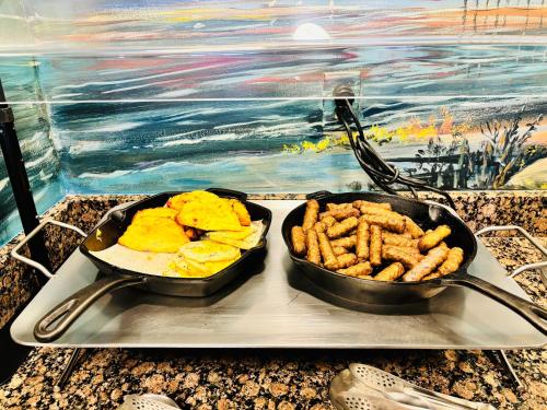 two pans of food on a tray on a table at Pier House 60 Clearwater Beach Marina Hotel in Clearwater Beach