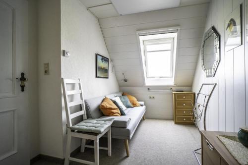 Postel nebo postele na pokoji v ubytování Haus Leysand - Ostfriesische Gemütlichkeit