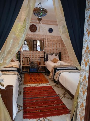 Postel nebo postele na pokoji v ubytování Dar Margot Marrakech