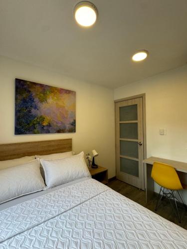 Postel nebo postele na pokoji v ubytování Hostelfc Javeriana