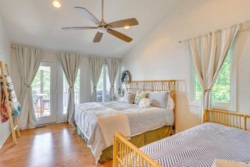 a bedroom with a bed and a ceiling fan at Lewis Smith Lake Retreat with Dock and Deck! in Logan