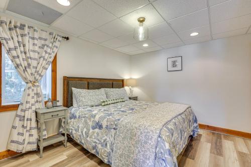 a bedroom with a bed and a window at Lewis Smith Lake Retreat with Dock and Deck! in Logan