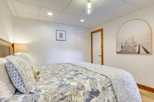 a bedroom with a bed and a mirror at Lewis Smith Lake Retreat with Dock and Deck! in Logan
