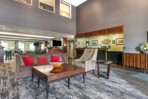 a living room with a couch and a table at Best Western Plus Eau Claire Conference Center in Eau Claire