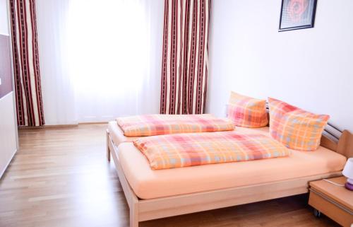 a couch with pillows on it in a living room at Ferienhaus Seerose in Baden-Baden