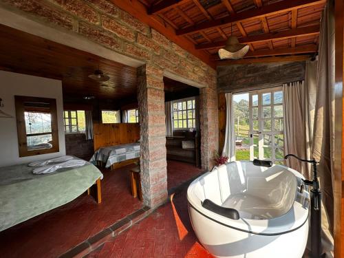 En eller flere senge i et værelse på Villa Italia hospedagem