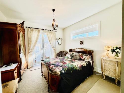 a bedroom with a bed and a window at Papanui Paris inspired Apartment in Christchurch