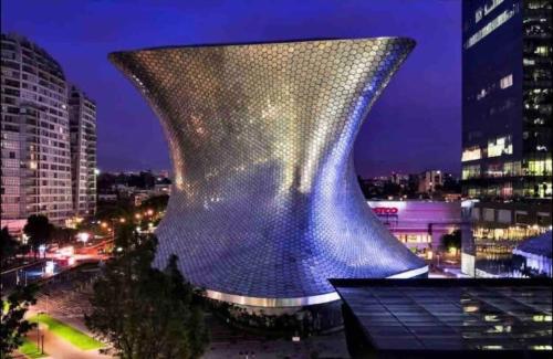 a steel vase on top of a building at night at Beautiful apartment w/amenities in front of CARSO in Mexico City