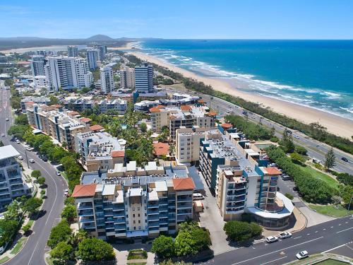 an aerial view of a city with a beach and buildings at Alex Beachfront Apartment in Alexandra Headland