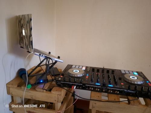 a record player sitting on top of a wooden stand at Sunny Home Guest House Masindi in Kampala