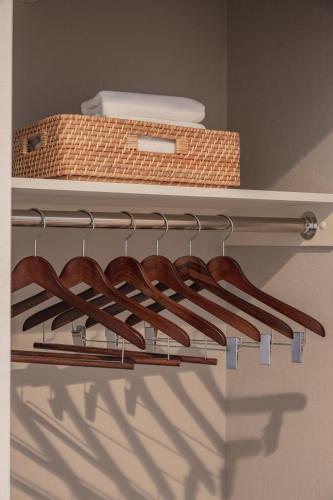 a row of knives on a shelf with a basket at Elite Inn Kyoto Station エリートイン京都駅 in Kyoto