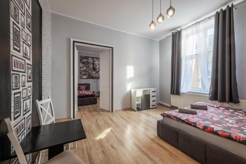 a living room with a couch and a table in it at 70s Guest room in Kraków