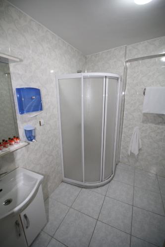 a bathroom with a shower and a sink at Selimiye Palace in Edirne